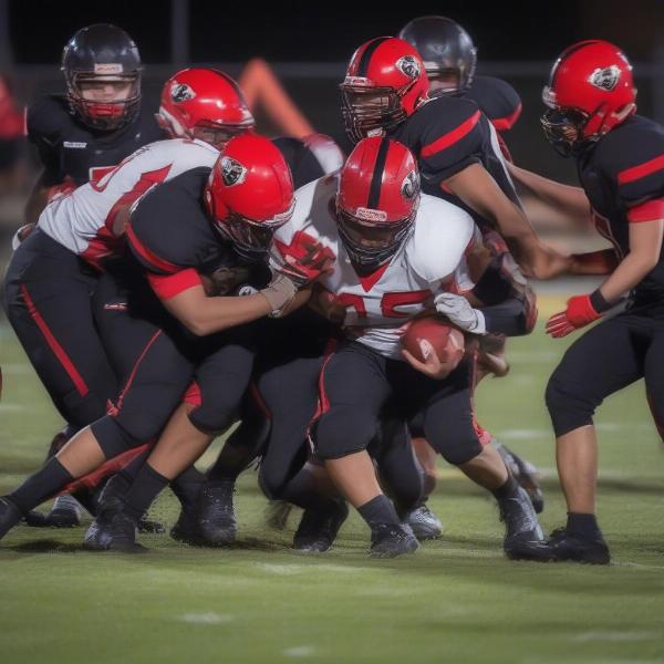 Aliquippa defense tackling an opponent player