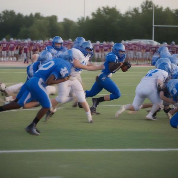 Brainerd Warrior football team action on the field with players in intense game