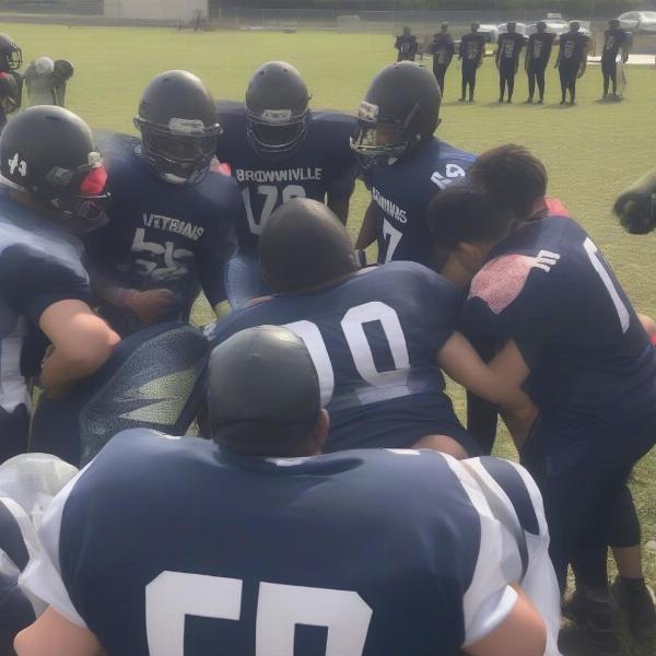 brownsville-veterans-football-team-huddle-strategy