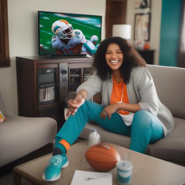 Dolphins fan enjoying the game on tv at home