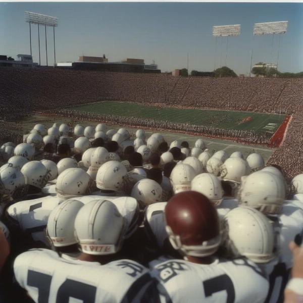 ed white football team huddle