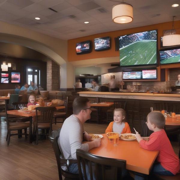 a family-friendly restaurant showing a bengals game on tv