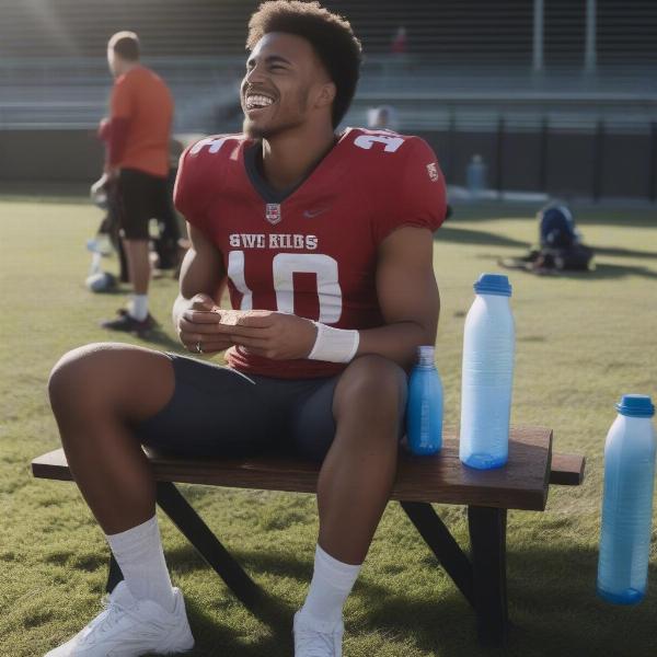 Football player enjoying post game protein snack