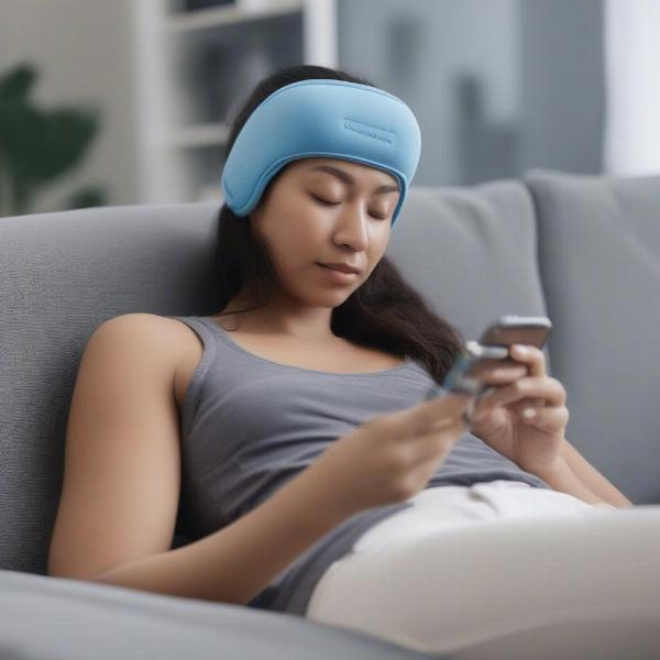 Gamer resting with ice pack on head, emphasizing need for recovery 