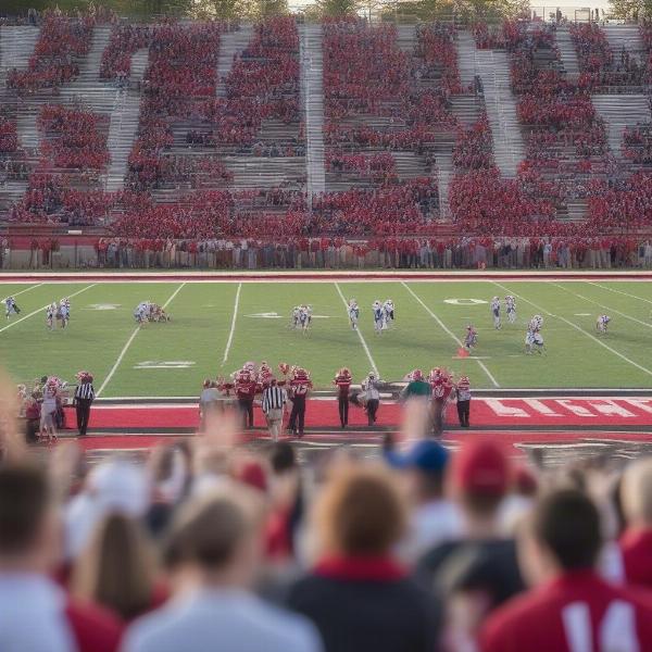 Glens Falls football community support with crowd cheering team