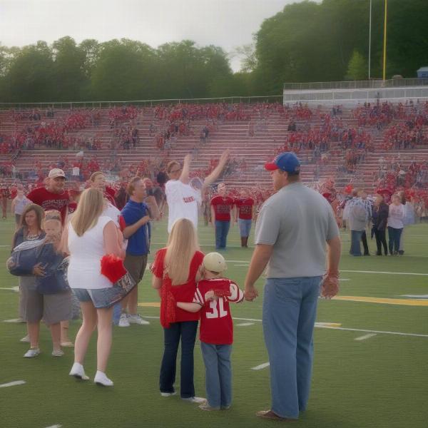 Glens Falls football town tradition with families at the game