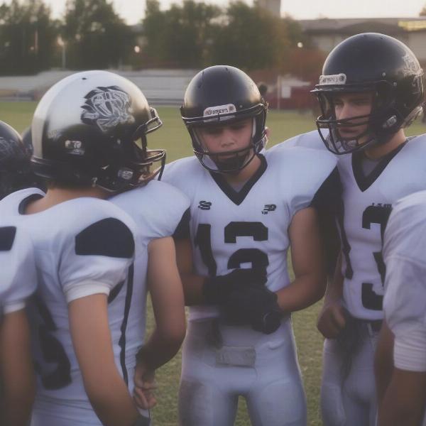 High School Football Players Huddle During Game
