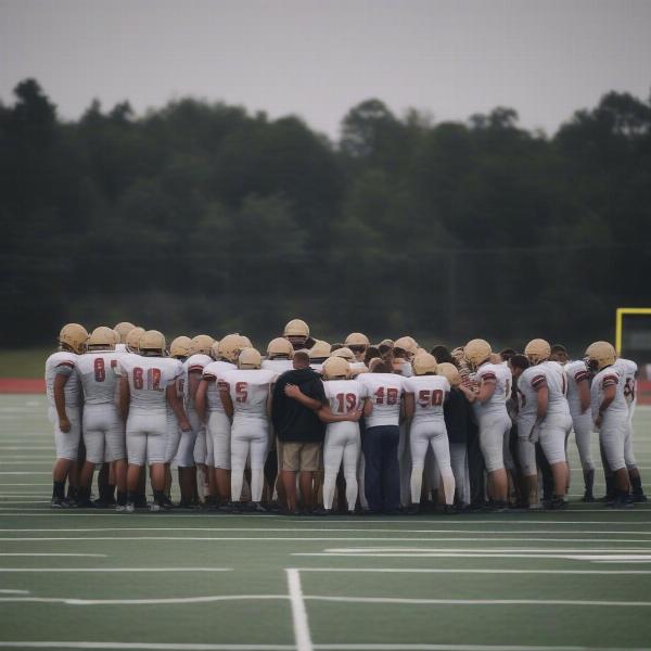 team-huddle-before-football-match