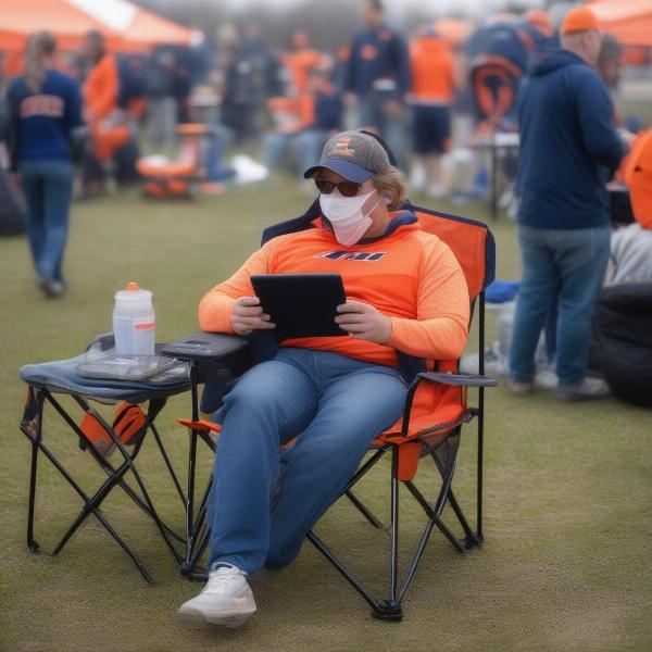 reading kindle at illini tailgate