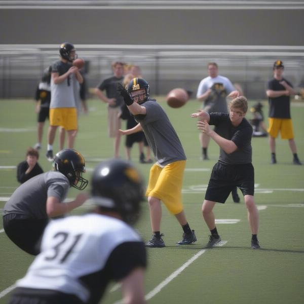 Iowa spring football quarterbacks battle