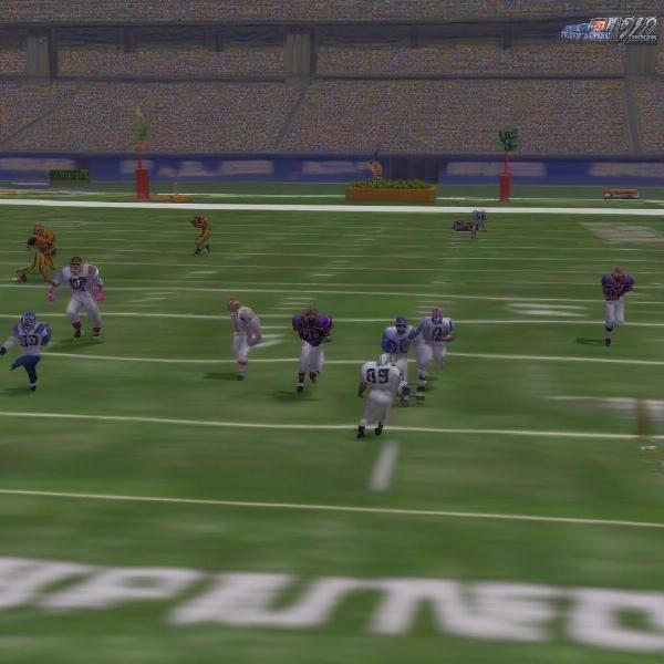 Madden NFL 2000 gameplay image, displaying Terrell Davis on field with various other players in the game