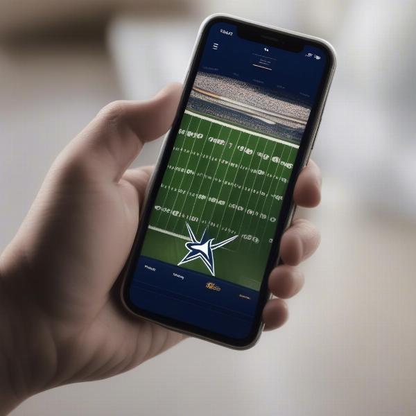 phone screen showing dallas cowboys game being streamed