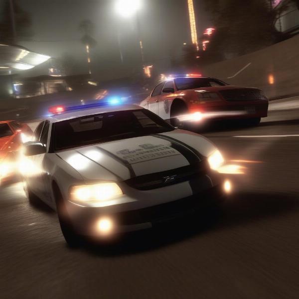 need for speed hot pursuit gameplay with police cars tailing a racer