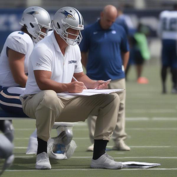 nfl coach deep in thought planning strategy