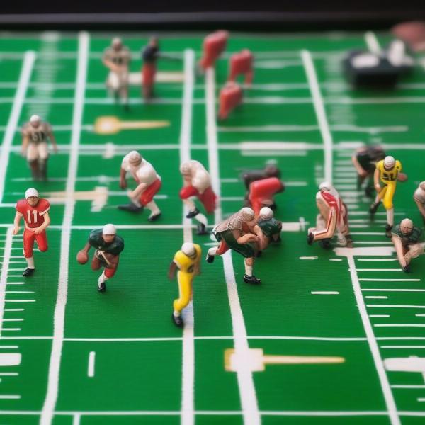 Close-up of an NFL electric football Tudor game showing player details and vibrant field