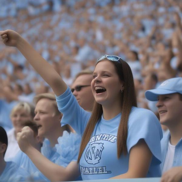 Excited North Carolina football fan cheers from the stadium seats