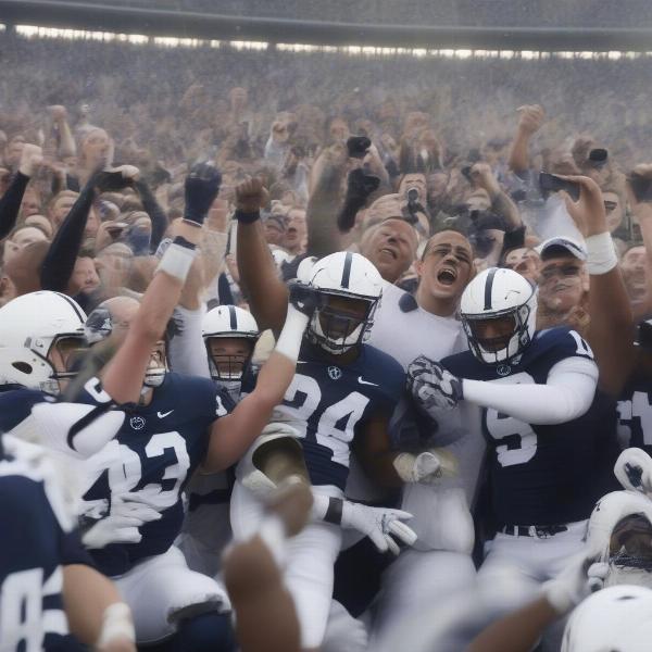Penn State football team celebrating a hard-fought victory with fans cheering