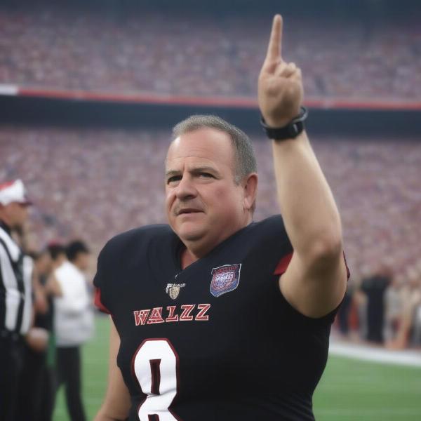 Walz giving middle finger at football game