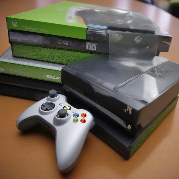 Close up of an Xbox 360 game cases and controller on the console itself